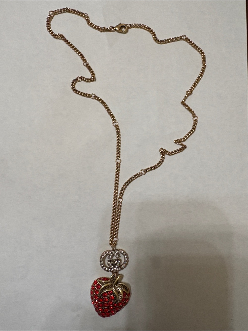Gold-Tone Necklace with Red Crystal Strawberry Pendant and Rhinestone Accent